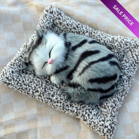 Cute & Adorable Sleeping Cat on Soft Bed